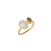 An adjustable sterling silver ring with two natural gemstones, one larger than the other, set in gold-plated mounting.